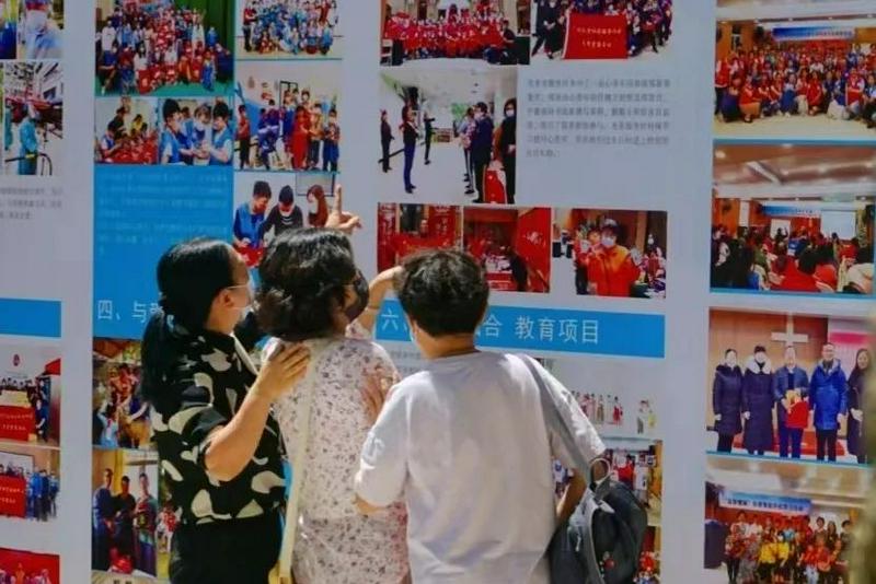 Three believers watched the charity achievement photo exhibition in Guangxiao Church, Guangzhou, Guangdong, on August 7, 2022. Guangxiao Church