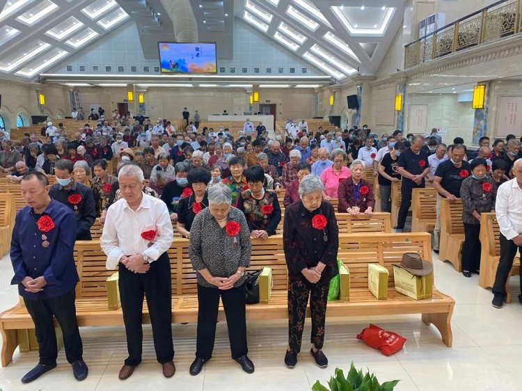 Aged believers prayed during a service held to honor the elderly in Jiaojiang Church, Taizhou, Zhejiang, in late-September, 2022.