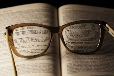 A pair of glasses on the Bible