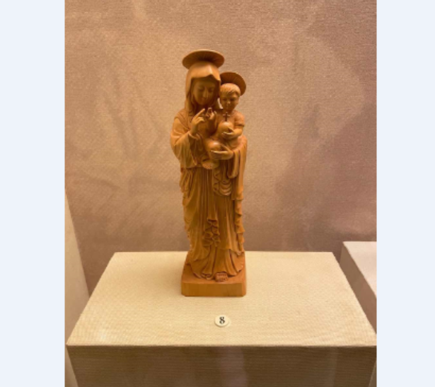 A wood carving of a mother and son in Tushan Bay Museum, Shanghai