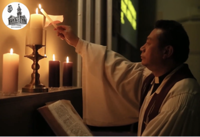 Senior Pastor Chen Anti lit a small candle from a big candle during a Christmas Eve candlelight worship service held in the Church of Heavenly Peace in Fuzhou, Fujian, on December 24, 2022.