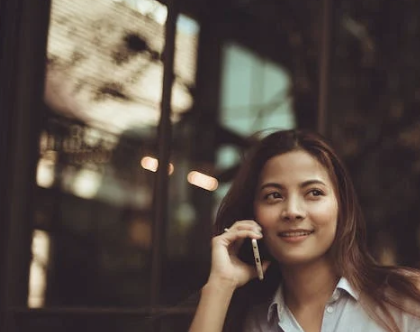 A picture of a woman on the phone