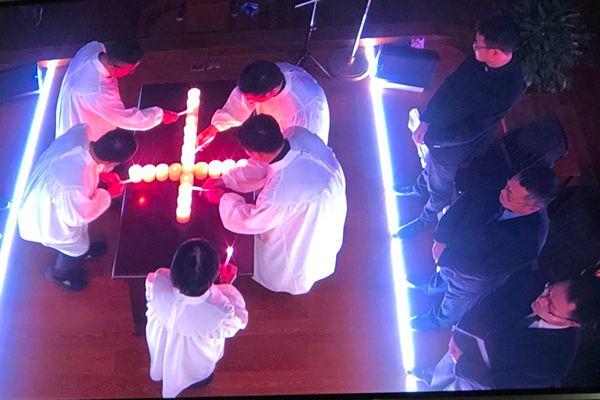 Church staff of Sicheng Church in Hangzhou, Zhejiang, lit a candle cross during a worship service on April 7, Good Friday, 2023.